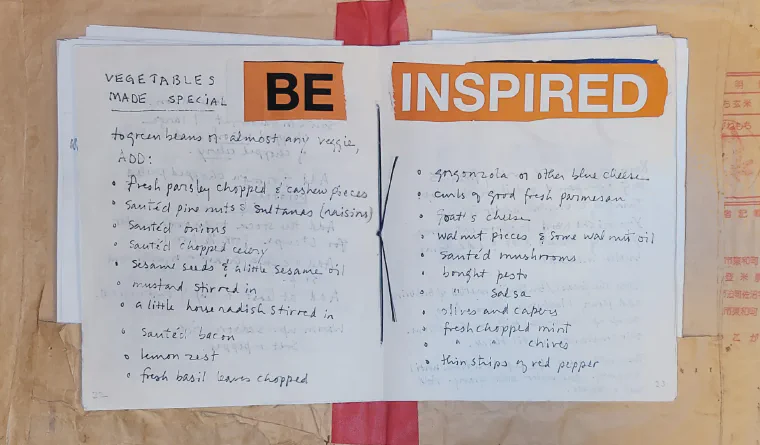 Mom's handmade family recipe cookbook open to a decorated page