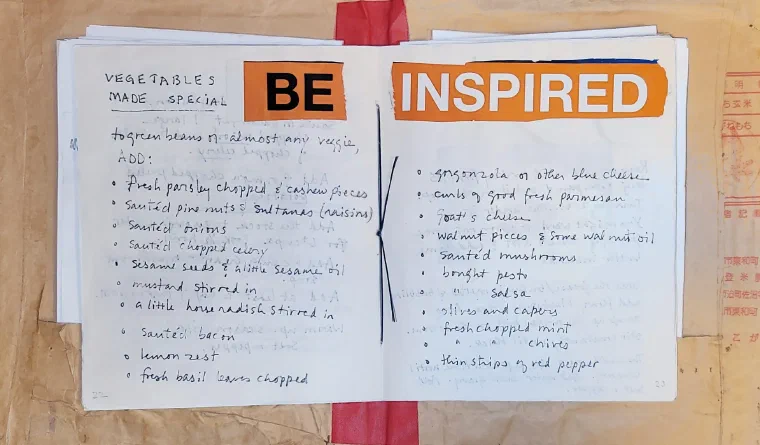 Mom's handmade family recipe cookbook open to a decorated page